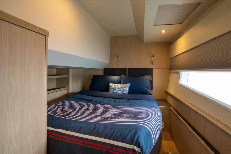 Slide: The Image of Luxurious bedroom interior of 2018 Aquila 44 Yacht with cozy bedding and modern design. - 32