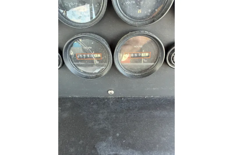 Slide: The Image of Instrument panel of a 1996 WEIST 62 Convertible showing hour meters. - 49
