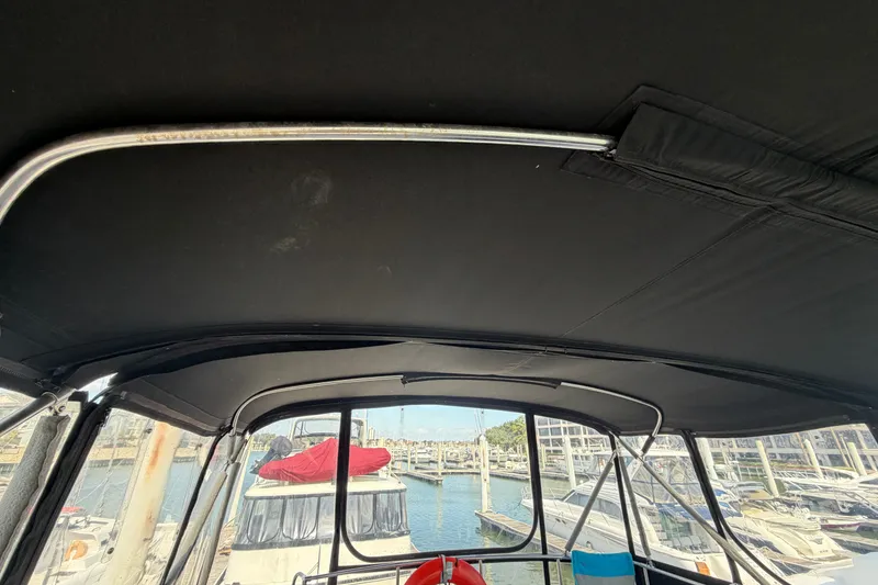 Slide: The Image of Interior view of a 1996 WEIST 62 Convertible yacht at a marina. - 48