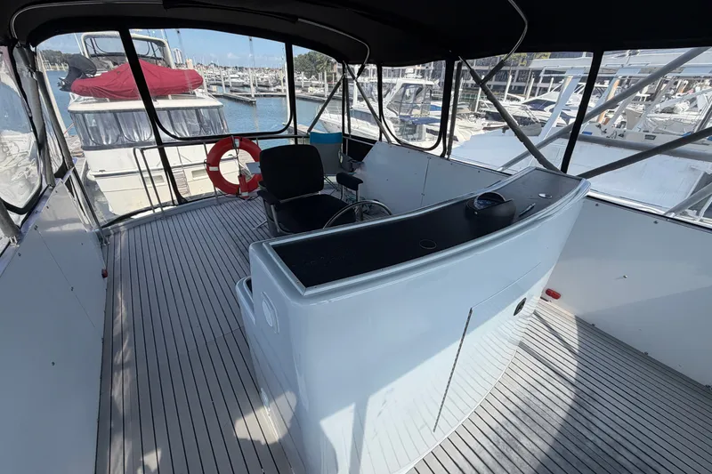 Slide: The Image of Interior view of a 1996 WEIST 62 Convertible yacht at a marina. - 46