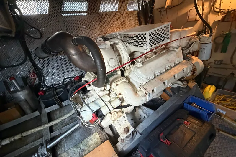 Slide: The Image of Engine room of 1996 WEIST 62 Convertible yacht, showcasing machinery and components. - 35