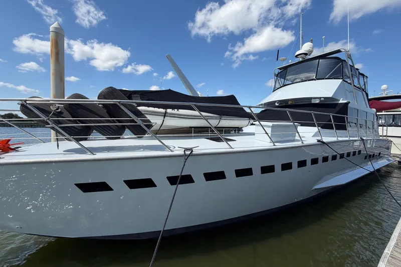 The Image of 1996 WEIST 62 Convertible yacht docked under a clear blue sky. - 0