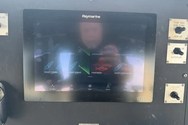 Slide: The Image of Raymarine navigation display on 1996 WEIST 62 Convertible boat dashboard. - 42