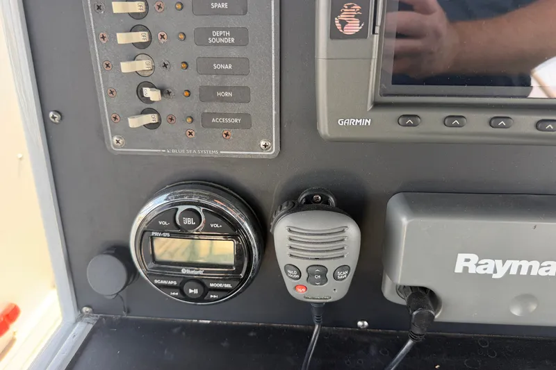 Slide: The Image of Control panel of a 1996 WEIST 62 Convertible boat with Garmin and Raymarine electronics. - 45