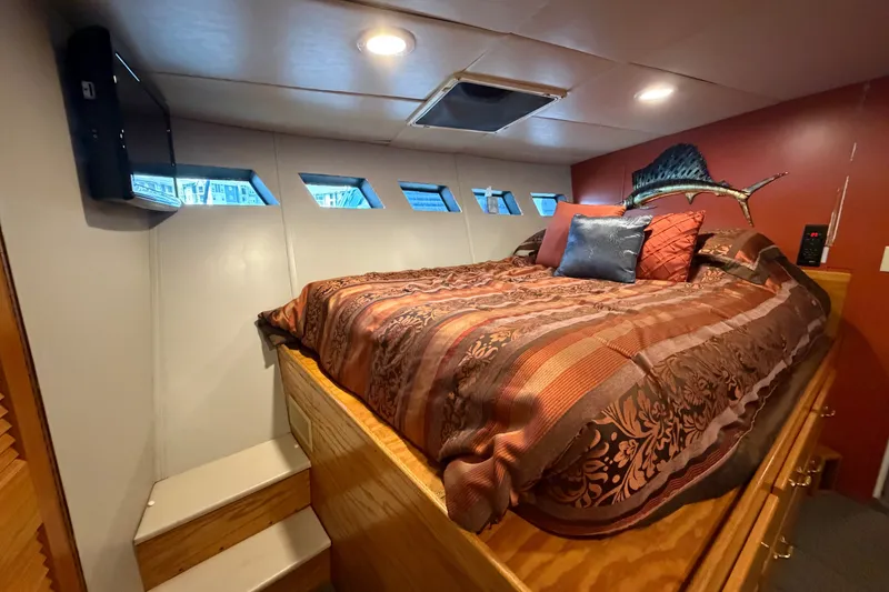 Slide: The Image of Luxurious bedroom interior of 1996 WEIST 62 Convertible yacht with elegant bedding and decor. - 23