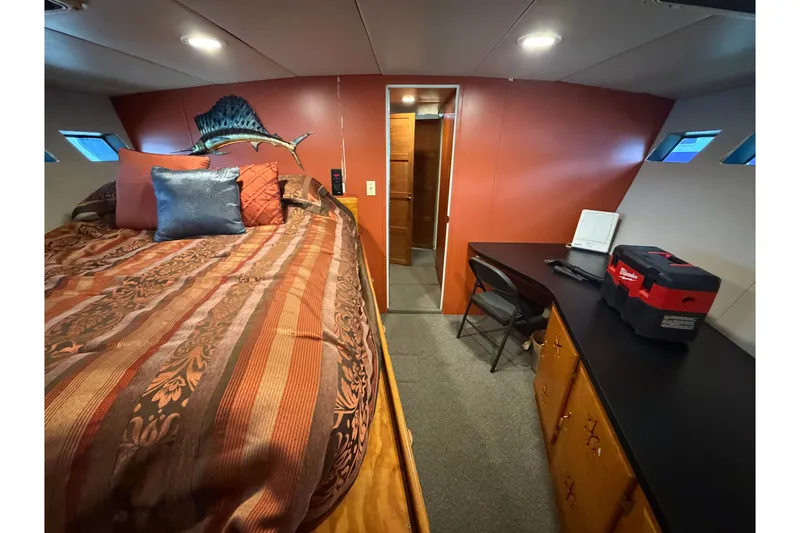 Slide: The Image of Interior of 1996 WEIST 62 Convertible yacht with bed, desk, and storage. - 24