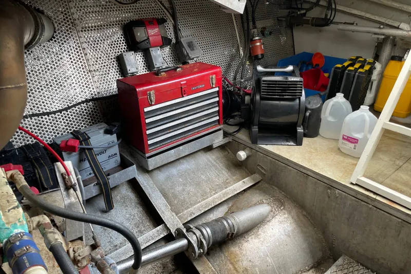 Slide: The Image of Engine room of a 1996 WEIST 62 Convertible with tools and equipment. - 40