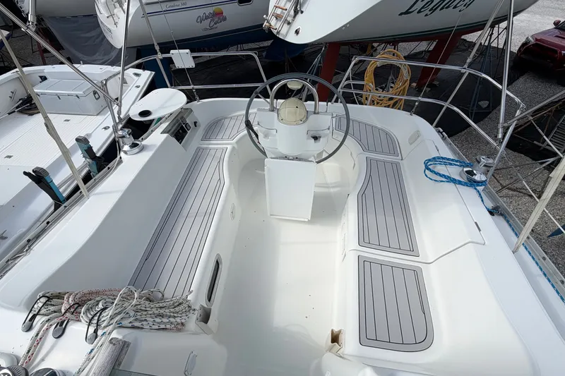 Slide: The Image of 2001 Beneteau Oceanis 331 sailboat cockpit with steering wheel and seating area. - 7