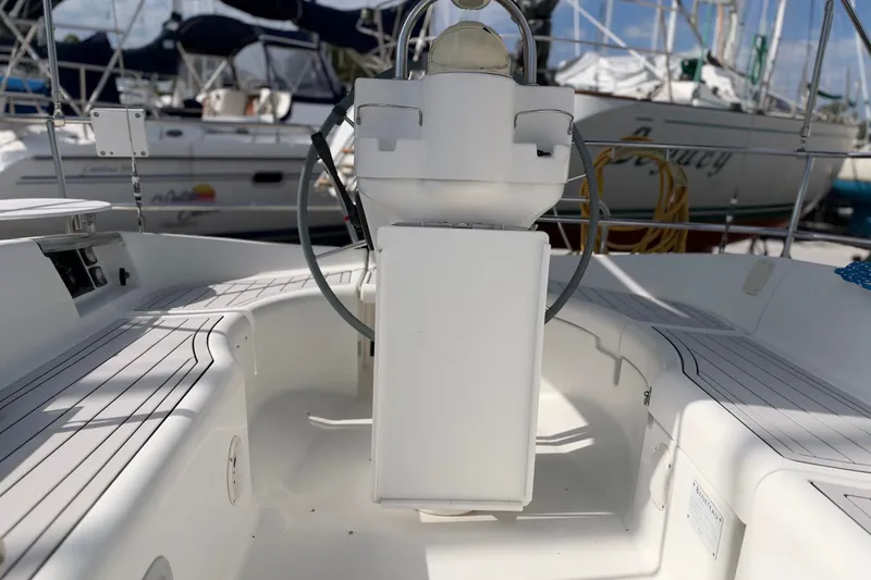 Slide: The Image of Cockpit of a 2001 Beneteau Oceanis 331 sailboat, featuring a central steering wheel. - 3
