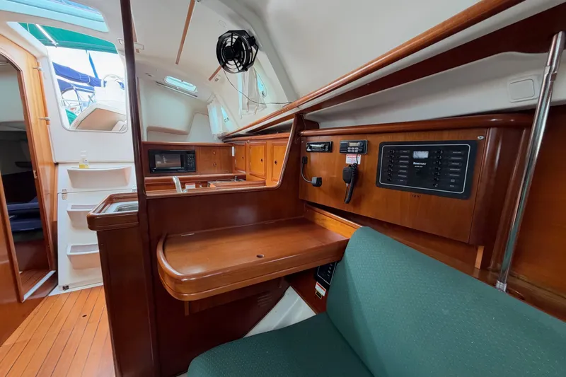 Slide: The Image of Interior of 2001 Beneteau Oceanis 331 sailboat with wood finish and navigation equipment. - 20