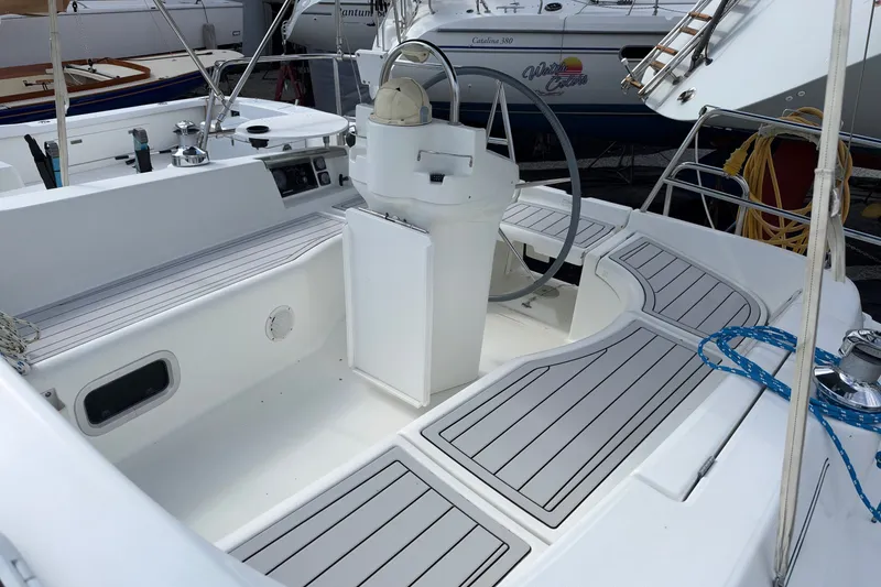 Slide: The Image of Cockpit of 2001 Beneteau Oceanis 331 sailboat with steering wheel and seating. - 6