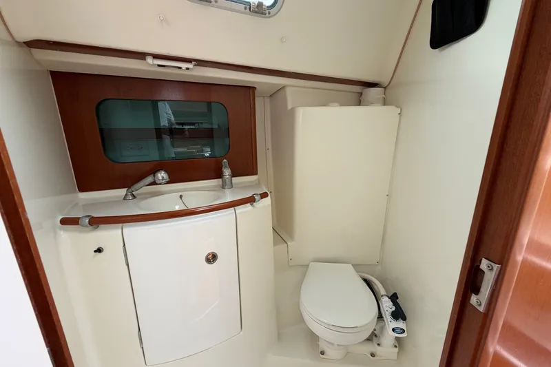 Slide: The Image of Beneteau Oceanis 331 (2001) yacht bathroom with sink and toilet. - 23