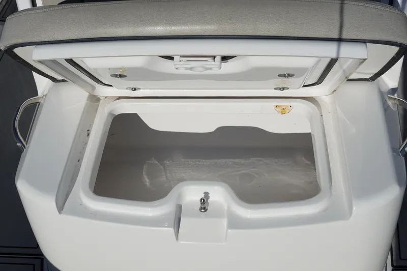 Slide: The Image of Open storage compartment on 2022 Sportsman Open 282TE Center Console boat. - 22