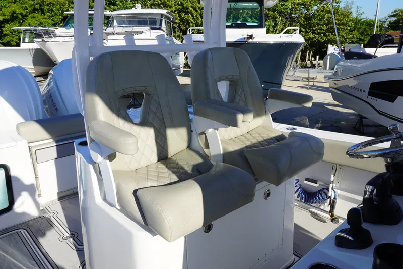 Slide: The Image of 2022 Sportsman Open 282TE Center Console boat seats, featuring luxurious design and comfort. - 10
