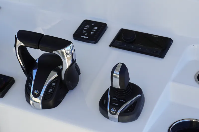 Slide: The Image of Control panel of 2022 Sportsman Open 282TE Center Console boat. - 12