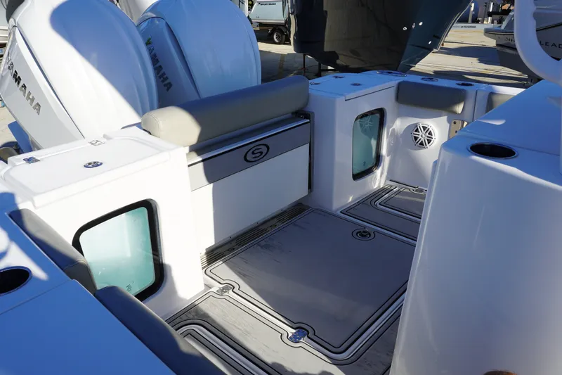 Slide: The Image of 2022 Sportsman Open 282TE Center Console boat interior with Yamaha engines. - 3