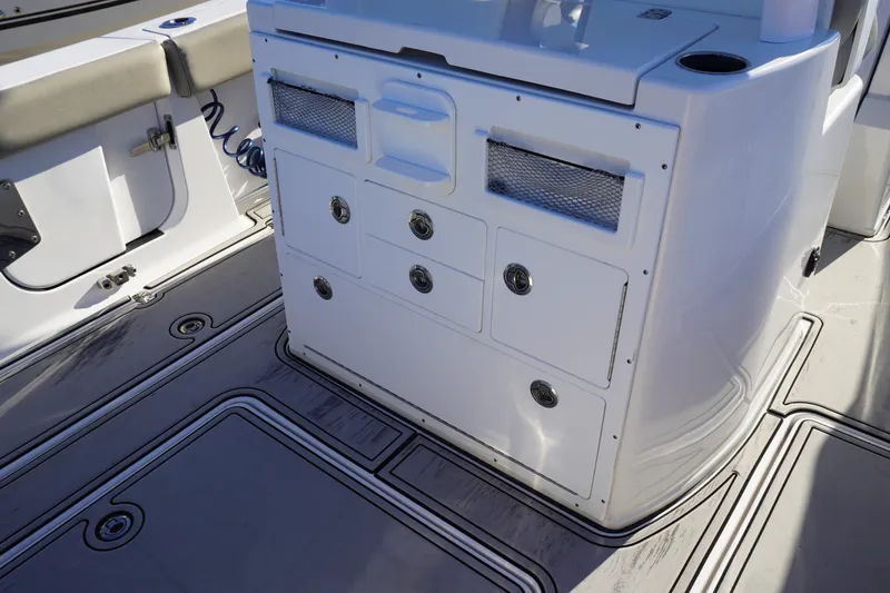 Slide: The Image of 2022 Sportsman Open 282TE Center Console boat interior with storage compartments. - 6
