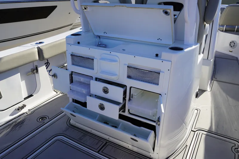 Slide: The Image of 2022 Sportsman Open 282TE Center Console with open storage compartments and seating. - 7