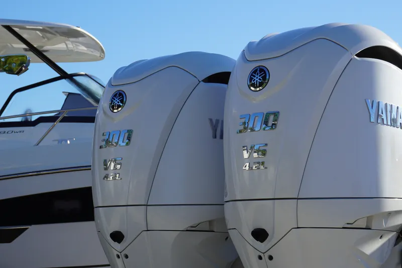 Slide: The Image of Twin Yamaha 300 V6 engines on a 2022 Sportsman Open 282TE Center Console boat. - 2
