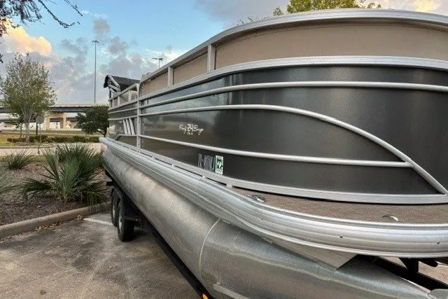 Slide: The Image of 2021 Sun Tracker Party Barge 24 DLX pontoon boat parked outdoors. - 33