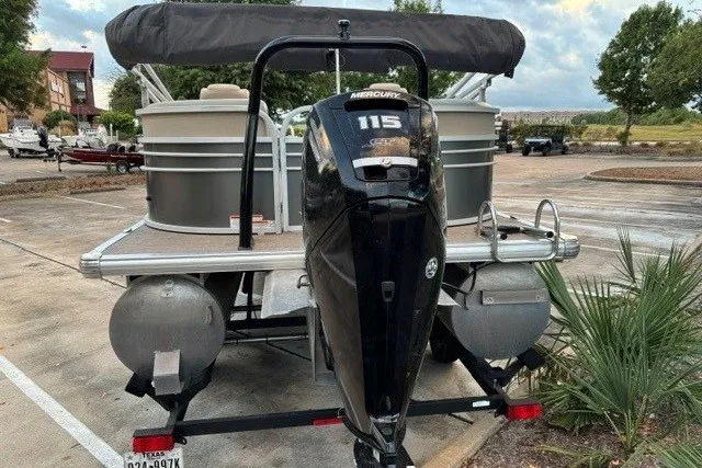 Slide: The Image of 2021 Sun Tracker Party Barge 24 DLX with Mercury 115 engine in parking lot. - 13
