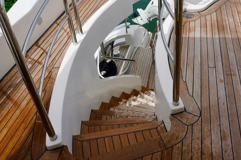 Slide: The Image of Luxurious wooden staircase on 2015 Azimut 84 yacht, featuring elegant design and polished finish. - 17