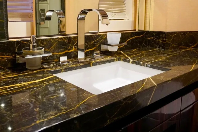 Slide: The Image of Luxurious marble bathroom sink in a 2015 Azimut 84 yacht. - 13