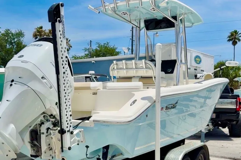 The Image of 2025 Bulls Bay 230 Center Console boat with outboard motor, parked on a trailer. - 0