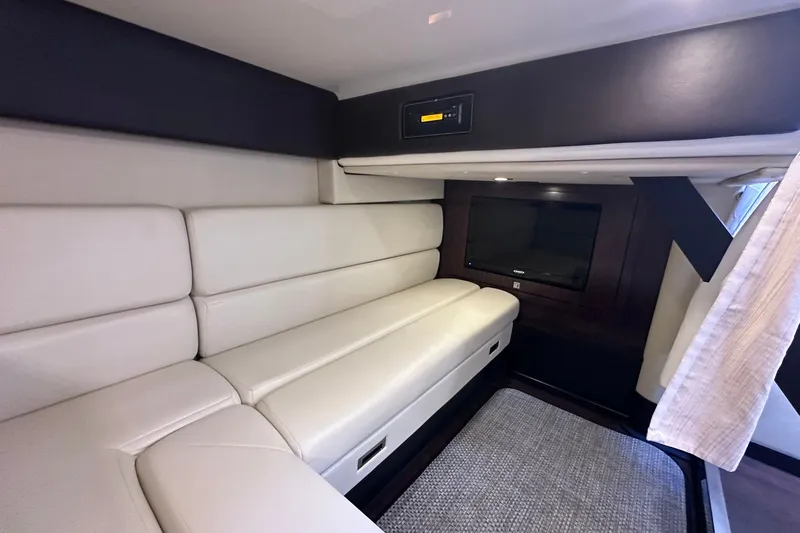 Slide: The Image of Luxurious interior of 2012 Monterey 340 Sport Yacht with plush seating and entertainment system. - 19