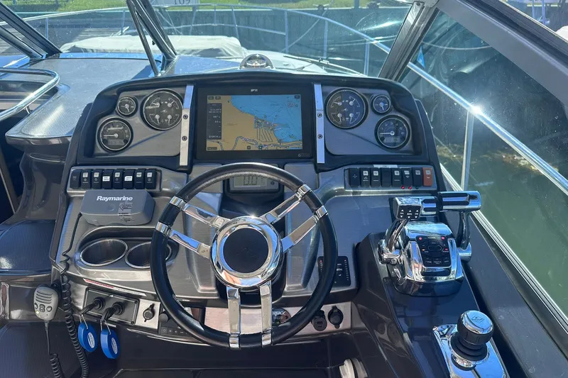 Slide: The Image of Cockpit of 2012 Monterey 340 Sport Yacht with navigation system and controls. - 13