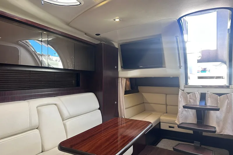 Slide: The Image of Luxurious interior of a 2012 Monterey 340 Sport Yacht with elegant seating and modern amenities. - 20