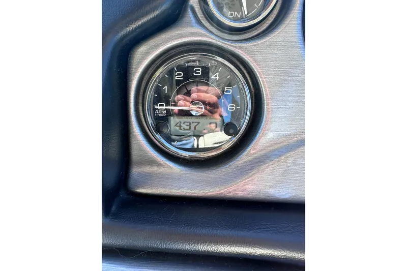 Slide: The Image of Close-up of a 2012 Monterey 340 Sport Yacht tachometer displaying 437 RPM. - 14