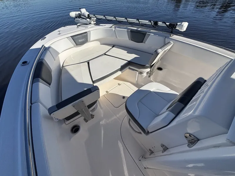 Slide: The Image of The image shows the deck of a 2021 Robalo R230 Center Console boat with seating. - 13