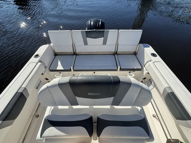 Slide: The Image of The image shows the cockpit of a 2021 Robalo R230 Center Console boat. - 11