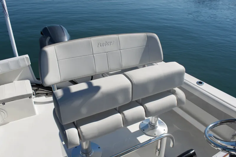 Slide: The Image of 2023 Parker 2300 Special Edition boat seating with sleek design on calm water. - 15