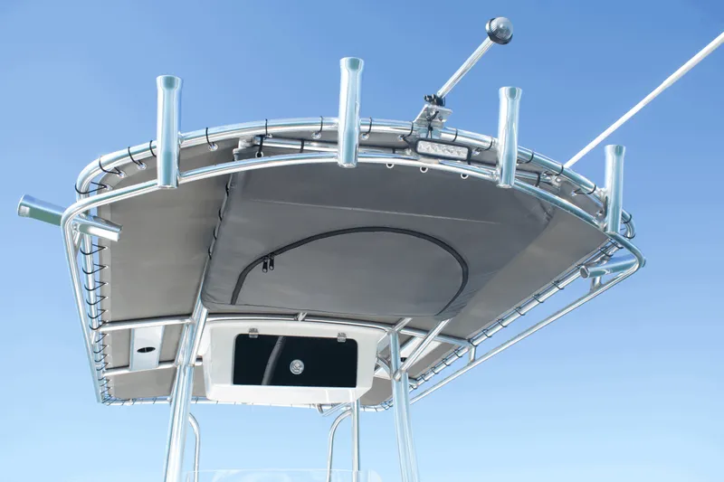 Slide: The Image of 2023 Parker 2300 Special Edition boat canopy with rod holders against clear blue sky. - 19