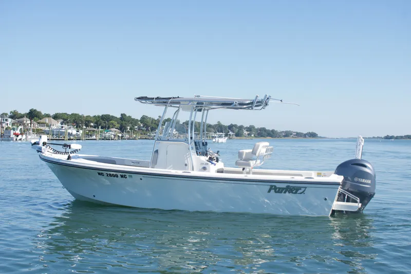 Slide: The Image of 2023 Parker 2300 Special Edition boat on calm water, featuring Yamaha engine. - 3