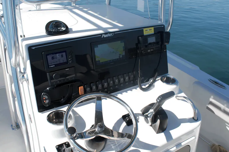 Slide: The Image of 2023 Parker 2300 Special Edition boat dashboard with navigation and control systems. - 13
