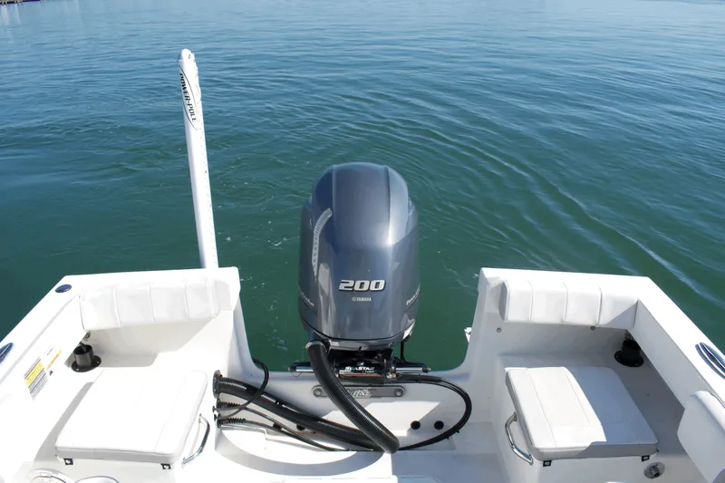 Slide: The Image of 2023 Parker 2300 Special Edition boat with Yamaha 200 engine on calm water. - 24