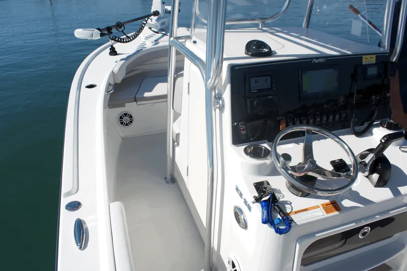 Slide: The Image of 2023 Parker 2300 Special Edition boat interior with steering console and navigation equipment. - 21