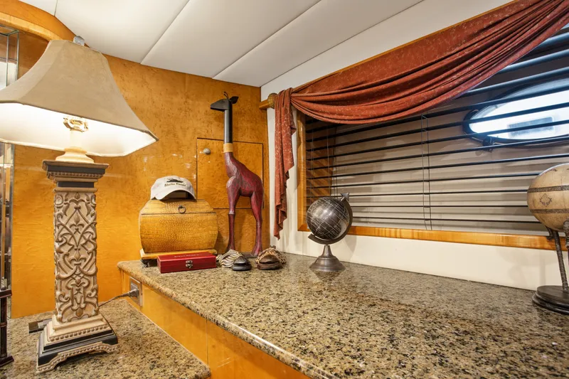 Slide: The Image of Luxurious interior of 1993 Johnson 56 Motor Yacht with elegant decor and accessories. - 16