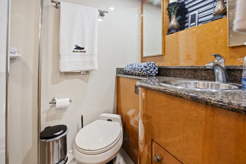 Slide: The Image of Luxurious bathroom on 1993 Johnson 56 Motor Yacht with granite countertop and modern fixtures. - 17