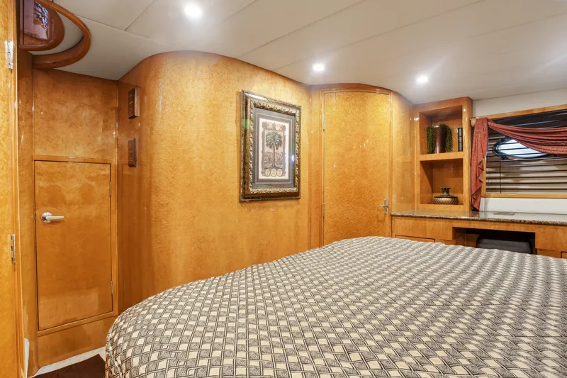 Slide: The Image of Luxurious cabin interior of a 1993 Johnson 56 Motor Yacht with elegant wood finishes. - 15