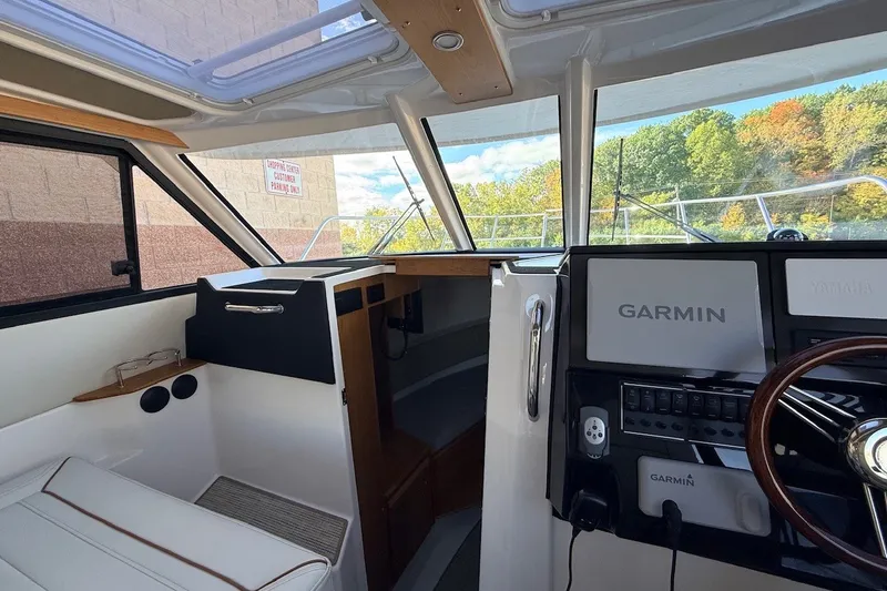Slide: The Image of Interior view of 2027 Cutwater C-288 Coupe boat with Garmin navigation system. - 15