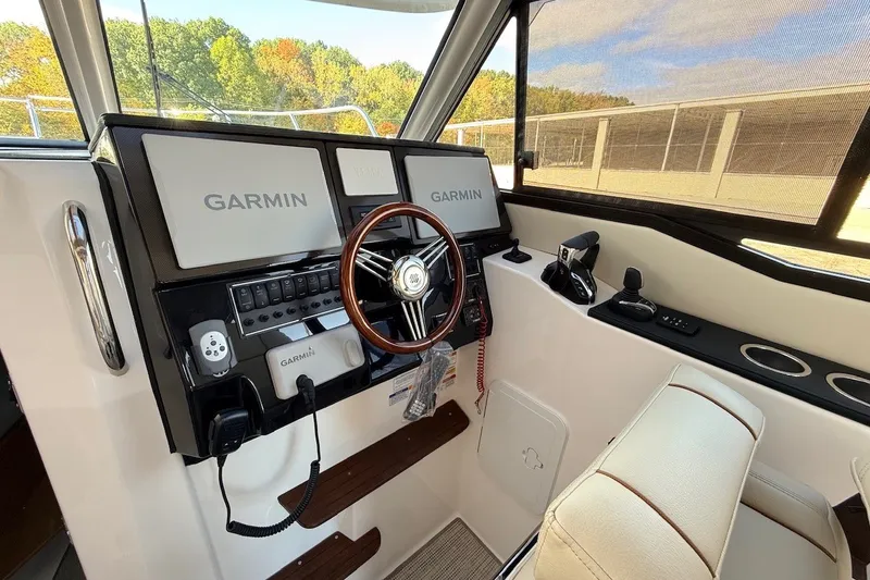 Slide: The Image of Interior cockpit of 2027 Cutwater C-288 Coupe with Garmin navigation displays. - 14