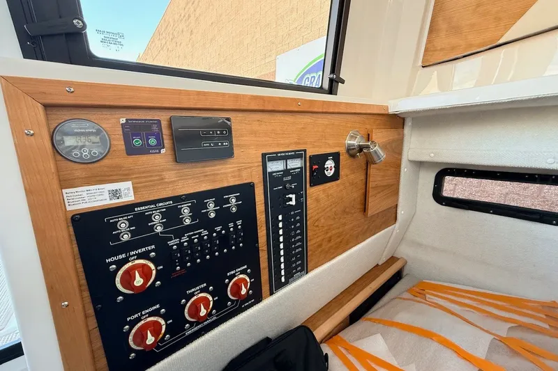 Slide: The Image of 2027 Cutwater C-288 Coupe interior control panel with essential circuits and gauges. - 13