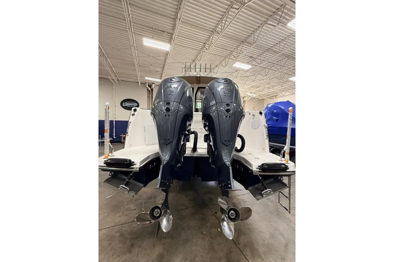 Slide: The Image of 2027 Cutwater C-288 Coupe with dual outboard engines in a showroom. - 20