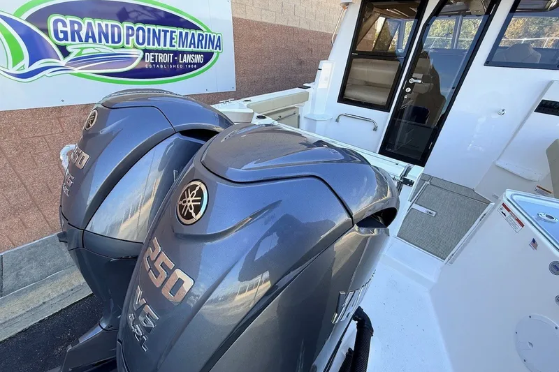 Slide: The Image of 2027 Cutwater C-288 Coupe with dual Yamaha 250 V6 engines at Grand Pointe Marina. - 3