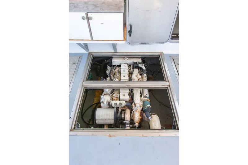 Slide: The Image of Engine compartment of 2002 Donelle Express Down East Lobster Boat, showcasing mechanical components. - 43