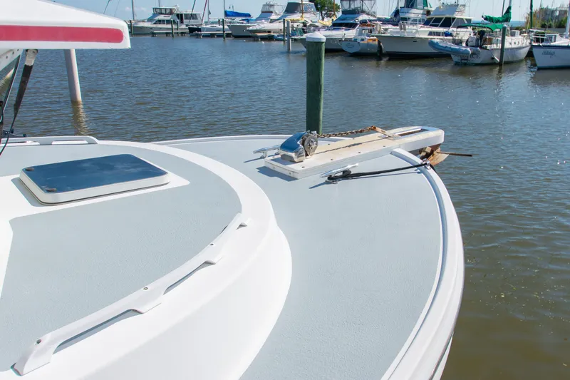 Slide: The Image of Bow of a 2002 Donelle Express Down East Lobster Boat docked in a marina. - 40